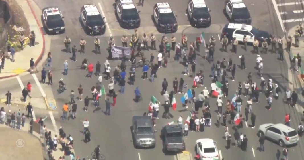 Protesters clash with law enforcement in Los Angeles amid immigration raids
