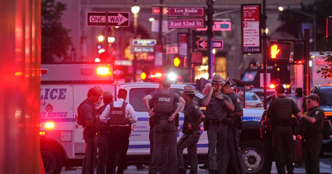 Chaotic scene in Midtown Manhattan after shots ring out in office tower, killing 4 including police officer